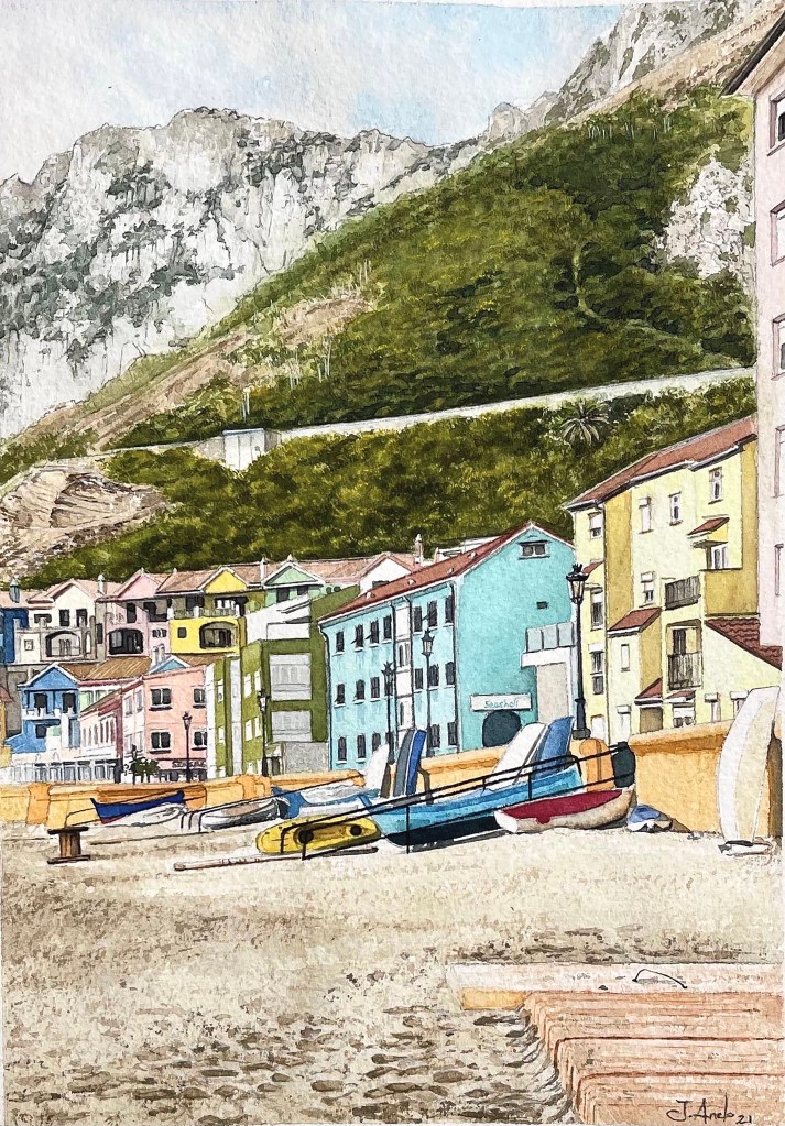 Watercolor painting of Catalan Bay, Gibraltar, with beach, houses, and distant green cliffs on a cloudy day.