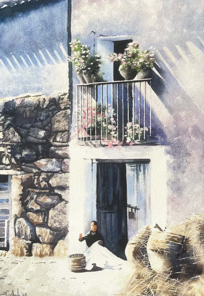 Watercolor of a woman embroidering outside a stone house, surrounded by baskets, flowers, and warm light